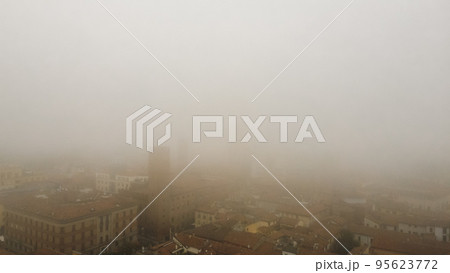 foggy cityscape aerial drone view of town center Cremona, Lombardy, Italy 95623772