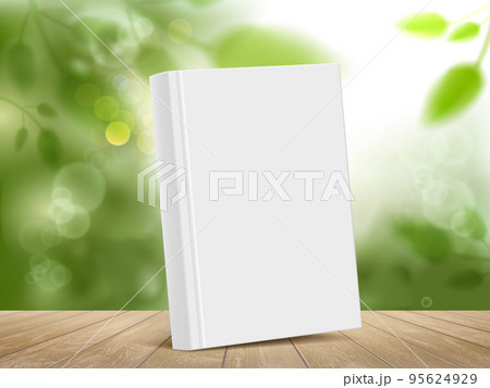 Mockup book with white cover on a wooden table. 95624929