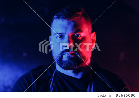 Neon light colorful red blue studio bearded white 30s man portrait Neon light colorful red blue studio bearded white 30s man portrait 95625090