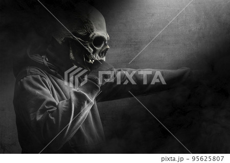 Man with a skull head costume Man with a skull head costume 95625807
