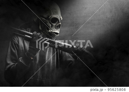 Man with a skull head costume holding gun Man with a skull head costume holding gun 95625808