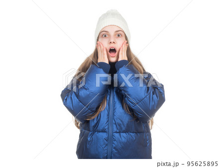 shocked teen girl in knitted hat puffer padded jacket warm clothes isolated on white, down jacket. shocked teen girl in knitted hat puffer padded jacket warm clothes isolated on white, down jacket. 95625895