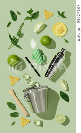 Mojito cocktail concept flat lay on green background 95627137