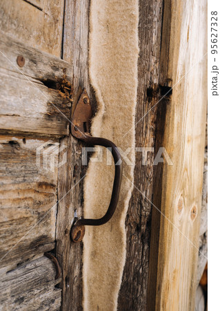 wooden barn door with handle. old wooden buildin 95627328