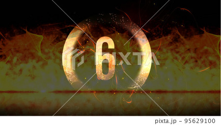 Image of ring and glowing number six in dramatic countdown over flaming fire background 95629100