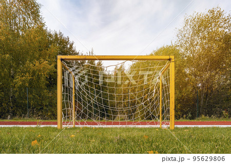 Front view of a small yellow football goals 95629806