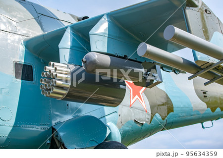 view of suspended weapons, bombs and missiles on a Soviet military combat helicopter view of suspended weapons, bombs and missiles on a Soviet military combat helicopter 95634359