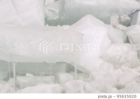Frosty ice icicles winter background. 95635020