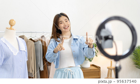 Beautiful woman with a social media influence is greeting the audience for recording vlog video live streaming, Online fashion clothing business, Using psychology to generate interest in customers. 95637540