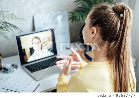 Young woman business woman student teacher tutor having online virtual video call. Freelancer having video conference calling on laptop computer talk by webcam learn teach in online chat Young woman business woman student teacher tutor having online virtual video call. Freelancer having video conference calling on laptop computer talk by webcam learn teach in online chat 95637777