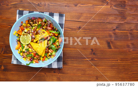 Cowboy caviar, texas caviar corn, beans, tomatoes, avocado, lime Served with nachos chips corn. Copy space Cowboy caviar, texas caviar corn, beans, tomatoes, avocado, lime Served with nachos chips corn. Copy space 95637780