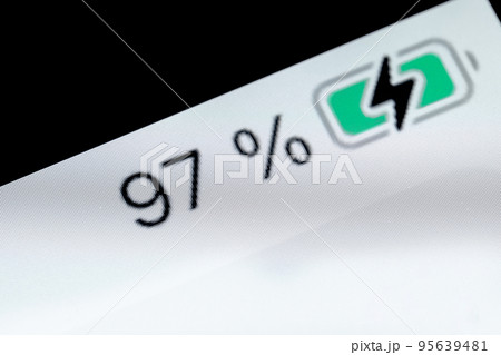 Smartphone charged battery level indicator - 97 percent: close up macro Smartphone charged battery level indicator - 97 percent: close up macro 95639481
