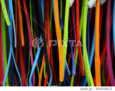 Colored leather bracelets and spring hooks on a shelf at fashion shop Colored leather bracelets and spring hooks on a shelf at fashion shop 95639822
