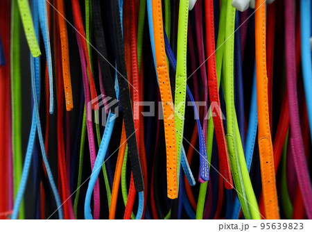 Colorful leather stripes on showcase in fashion shop Colorful leather stripes on showcase in fashion shop 95639823