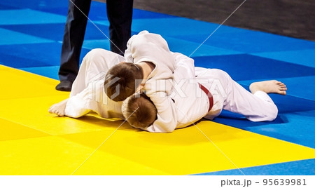 Two boys fighter compete in Judo Two boys fighter compete in Judo 95639981