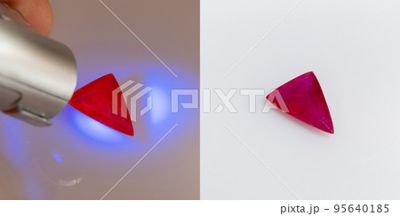 Natural gemstone red ruby on a white background and under ultraviolet Natural gemstone red ruby on a white background and under ultraviolet 95640185