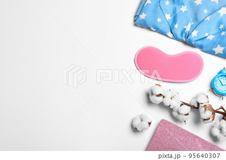 Composition with sleeping mask on white background, top view. Bedtime accessories 95640307