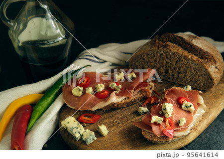 rye bread with slices of jamon and cheese rye bread with slices of jamon and cheese 95641614