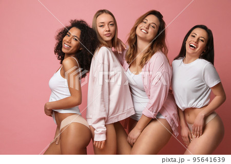 Group of women with different body types in underwear on pink background 95641639