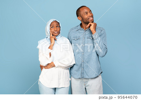 African American Couple Posing Dreaming And Thinking On Yellow Background African American Couple Posing Dreaming And Thinking On Yellow Background 95644070
