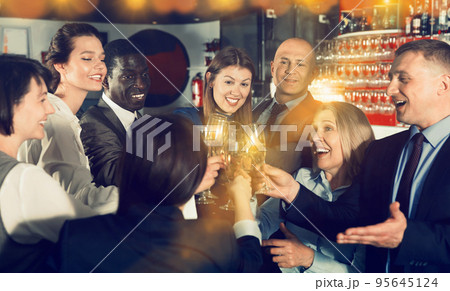 International group of businesspeople toasting with champagne, h International group of businesspeople toasting with champagne, h 95645124