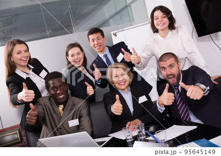 international team emotionally gesturing and celebrating 95645149