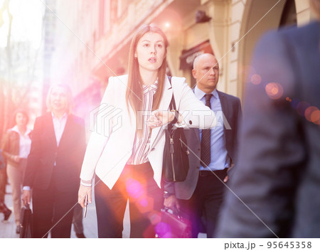 Woman in business suit hurry up Woman in business suit hurry up 95645358