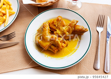 Braised pettitoes, spicy pig feet cooked with sauce 95645427