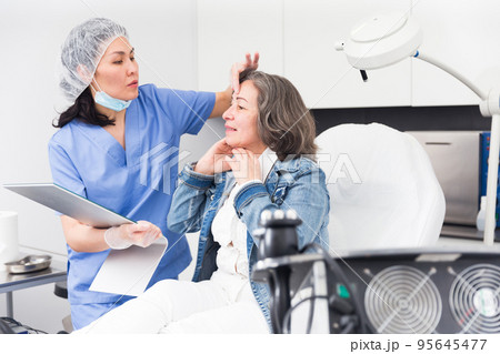Woman satisfied with results of cosmetic procedures 95645477