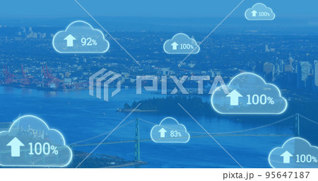 Composite of numbers with percentage and up arrow signs in clouds over aerial view of cityscape Composite of numbers with percentage and up arrow signs in clouds over aerial view of cityscape 95647187