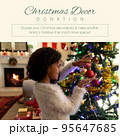 Square image of biracial girl decorating christmas tree with christmas decor donation text 95647685