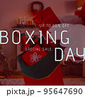 Square image of santa claus holding gifts and boxing day up to 50 percent text 95647690