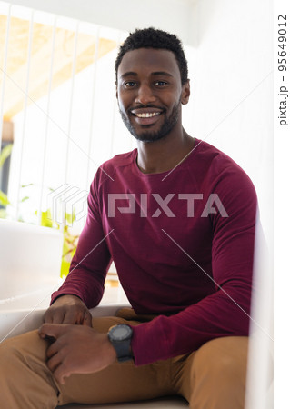Portrait of happy african american man looking at camera and smiling 95649012