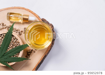 Set of legalized marijuana products displayed on a wooden plate. Set of legalized marijuana products displayed on a wooden plate. 95652078