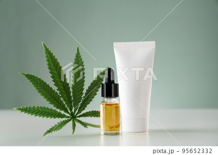 Distillation of marijuana leaf into CBD oil for dermatological purpose concept. Distillation of marijuana leaf into CBD oil for dermatological purpose concept. 95652332