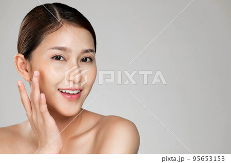 Closeup ardent young woman posing beauty gesture with clean fresh skin. Closeup ardent young woman posing beauty gesture with clean fresh skin. 95653153