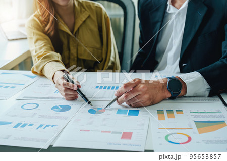 Portrait of a female business owner and partner company meeting to collaborate to invest in imported goods, plan to increase marketing profits using budget documents and working calculator. Portrait of a female business owner and partner company meeting to collaborate to invest in imported goods, plan to increase marketing profits using budget documents and working calculator. 95653857