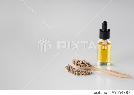Distillation of marijuana, CBD oil in glass bottle with a dropper lid wallpaper. 95654308