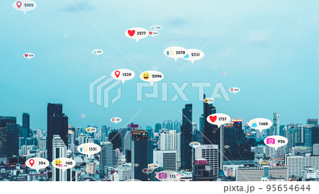 Social media icons fly over city downtown showing people reciprocity connection 95654644