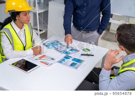Engineers and competent employer discussing together with tablet in the office. Engineers and competent employer discussing together with tablet in the office. 95654878