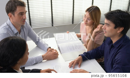 Commercial, agreement deal signed by competent people of several ethnicities. 95655108