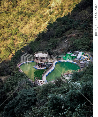 Top view of boating point in Kempty Falls in Mussourie, Uttarakhand, India. Popular place includes cascading waterfalls, pools,  boating with vantage points and cafes 95663407