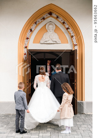 bride and groom waiting outside the church for the wedding ceremony bride and groom waiting outside the church for the wedding ceremony 95663662