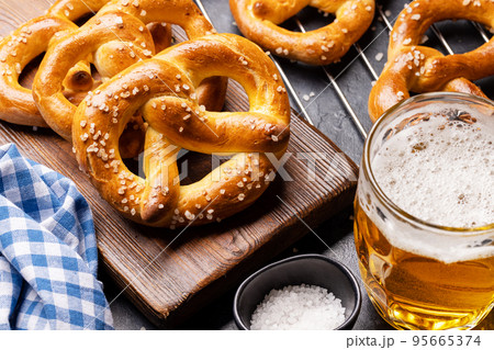 Freshly baked homemade pretzels and beer 95665374