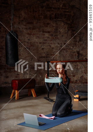 Portrait of a young female online trainer Portrait of a young female online trainer 95665509
