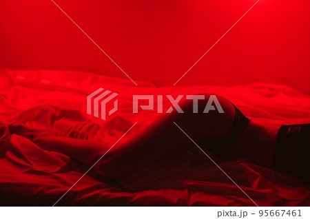 slender girl with a sexy body in beautiful underwear erotically lies on the bed 95667461