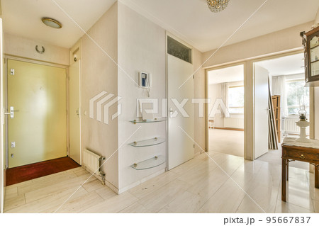 Perspective view of hallway with white walls and parquet floor in minimalist style apartment Perspective view of hallway with white walls and parquet floor in minimalist style apartment 95667837