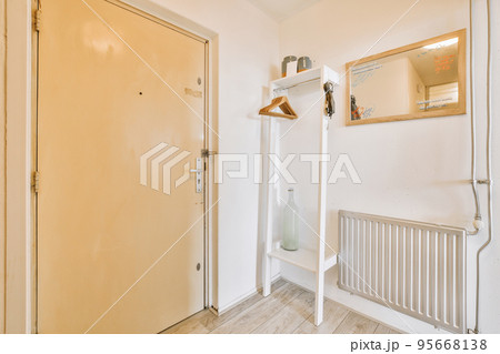 Plastic window and radiator on white wall in empty light room at home 95668138