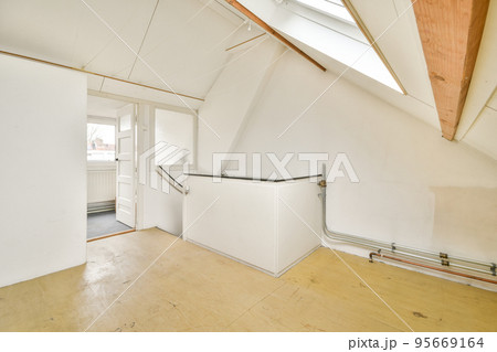 Boiler room of an apartment building with pipes and metering devices. A long room with engineering communications in the modern apartment 95669164