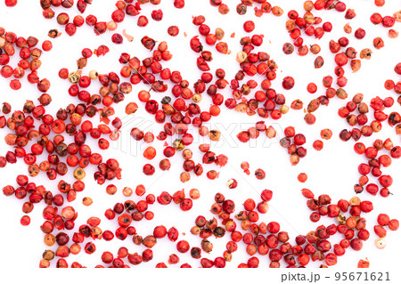 Pink peppercorns seeds isolated on white background. 95671621